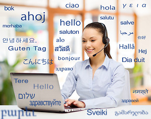 Image showing woman with laptop over words in foreign languages