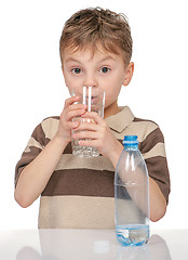 Image showing Little boy with bottle of water