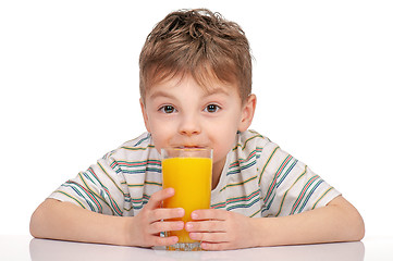 Image showing Little boy with orange juice