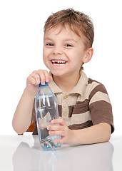 Image showing Little boy with bottle of water