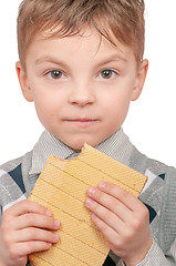 Image showing Little boy eating waffle