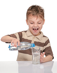 Image showing Little boy with bottle of water