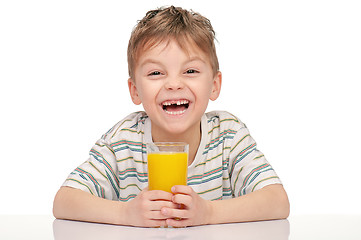 Image showing Little boy with orange juice