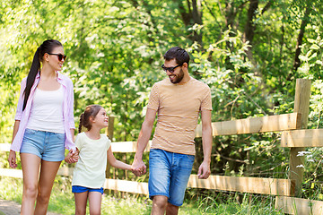 Image showing happy family walking in summer park