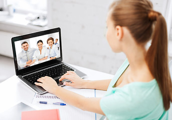 Image showing woman or student having video interview on laptop