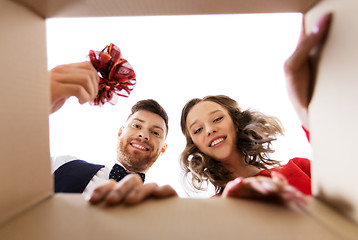 Image showing happy couple opening christmas gift box