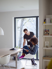 Image showing multiethnic couple relaxing at modern home indoors