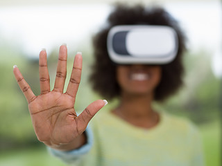 Image showing black woman using VR headset glasses of virtual reality