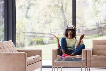 Image showing black woman using VR headset glasses of virtual reality