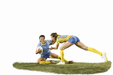 Image showing The young female rugby players isolated on white backround