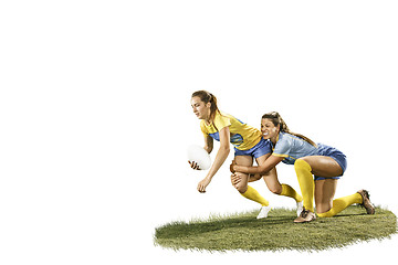 Image showing The young female rugby players isolated on white backround