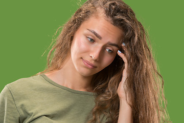 Image showing Young serious thoughtful woman. Doubt concept.