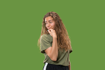 Image showing Young serious thoughtful woman. Doubt concept.