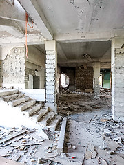 Image showing The ruins of a large destroyed building, pieces of stone, concrete, clay and metal.