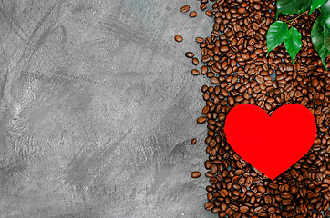 Image showing Red cardboard heart on a pile of coffee beans on a vintage background