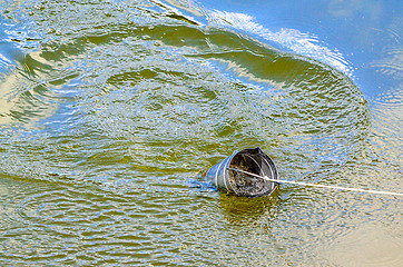 Image showing Take samples of water for laboratory testing. The concept - analysis of water purity, environment, ecology.