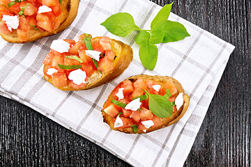 Image showing Bruschetta with tomato and feta on board top