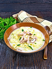 Image showing Soup creamy of chicken and pasta in plate on wooden table