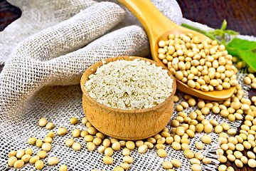 Image showing Flour soy in bowl with soybeans on board