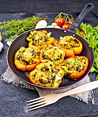 Image showing Pepper stuffed with mushrooms and couscous in pan on table