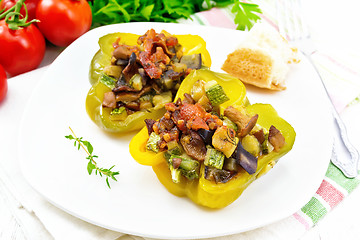 Image showing Pepper stuffed with vegetables in plate on board