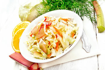 Image showing Salad of cabbage and rhubarb in plate on white board