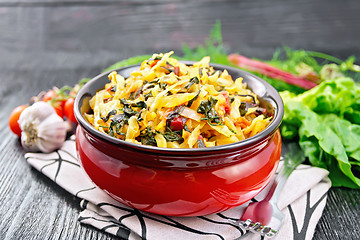 Image showing Cabbage stew with chard in bowl on board