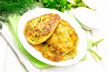 Image showing Pancakes of zucchini on white board