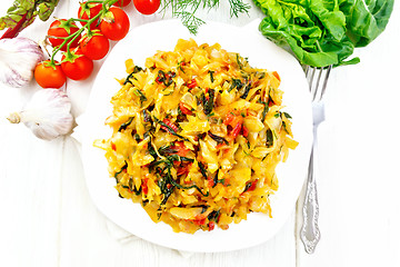 Image showing Cabbage stew with chard in plate on board top