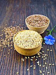 Image showing Flaxen white and brown seed in bowl with flower on board