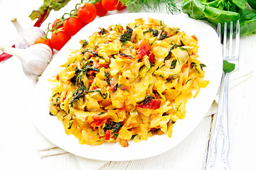 Image showing Cabbage stew with chard in plate on white board