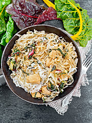 Image showing Funchoza with chard and meat in pan on black board top