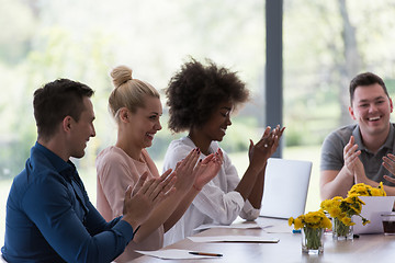 Image showing multiethnic startup Group of young business people celebrating s