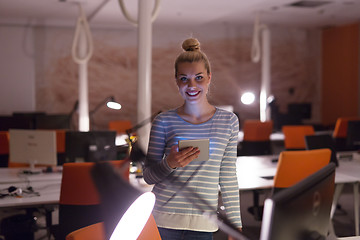 Image showing woman working on digital tablet in night office