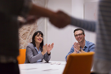 Image showing cloasing the deal in modern office interior