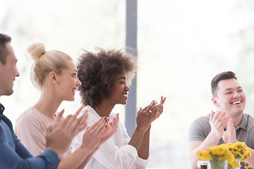 Image showing multiethnic startup Group of young business people celebrating s