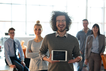 Image showing Portrait of a young businessman holding tablet