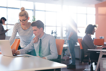 Image showing Two Business People Working With laptop in office