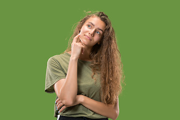 Image showing Young serious thoughtful woman. Doubt concept.