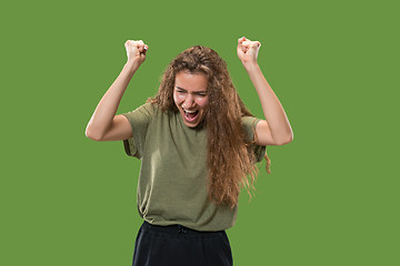 Image showing Winning success woman happy ecstatic celebrating being a winner. Dynamic energetic image of female model