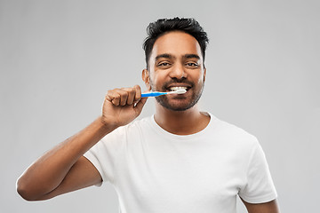 Image showing indian man with toothbrush cleaning teeth