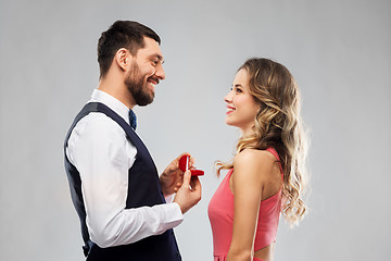 Image showing man giving woman engagement ring on valentines day