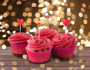 Image showing close up of cupcakes with heart cocktail sticks