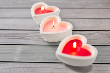 Image showing heart shaped candles burning on valentines day