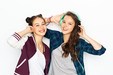 Image showing teenage girls in earphones listening to music