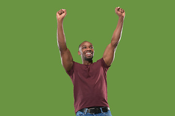 Image showing Winning success man happy ecstatic celebrating being a winner. Dynamic energetic image of male model