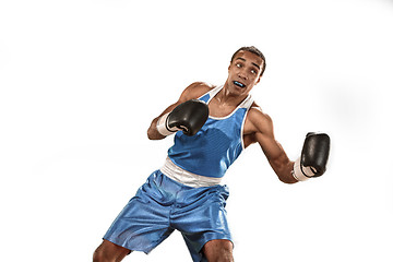 Image showing Sporty man during boxing exercise. Photo of boxer on white background