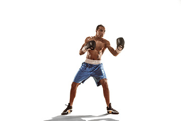 Image showing Sporty man during boxing exercise. Photo of boxer on white background