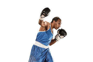 Image showing Sporty man during boxing exercise. Photo of boxer on white background