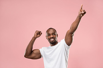 Image showing Winning success man happy ecstatic celebrating being a winner. Dynamic energetic image of male model